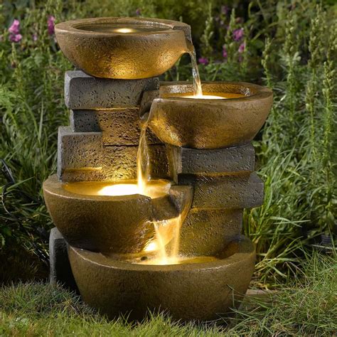 The natural-looking grey stone makes it fit in any kind of style fo your patio or garden. . Outdoor fountain lights